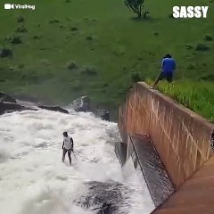 Brave Man Risks His Life To Save A Dog From Water Dam