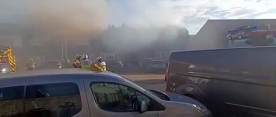 Firefighters battle a house blaze