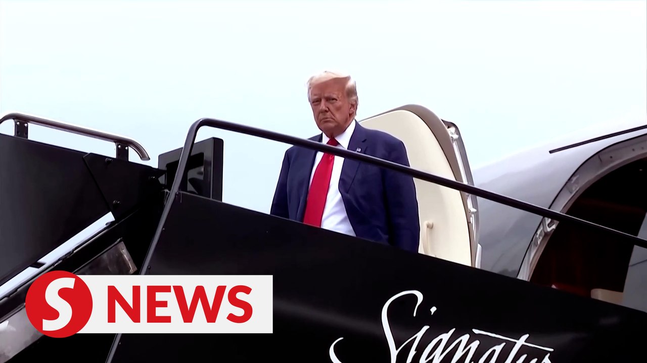 Trump plans to turn himself in on Thursday over...