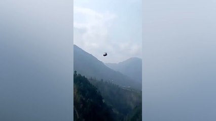 Children among eight trapped in chairlift dangling 900ft above ravine in Pakistan
