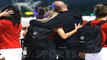 Spanish FA chief hugs World Cup winning goal-scorer Olga Carmona as the team returns to Madrid - after he was forced to apologise for kissing a player on the lips