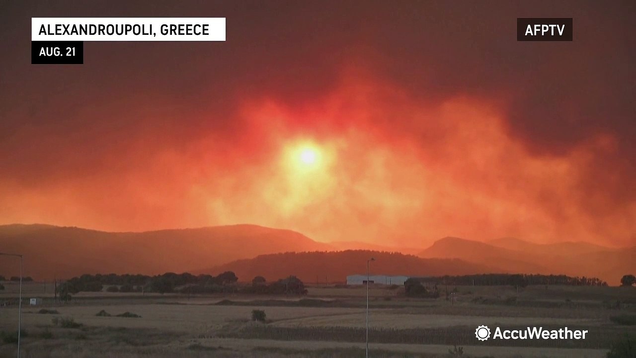 Sunset turns smoke-filled sky orange