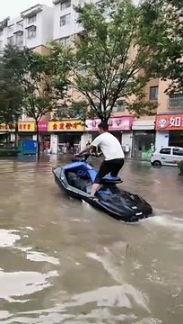 Jet Skiing Through Flooded Streets