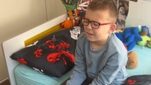 Silent smile followed by happy tears when boy gets surprised with a cute kitten