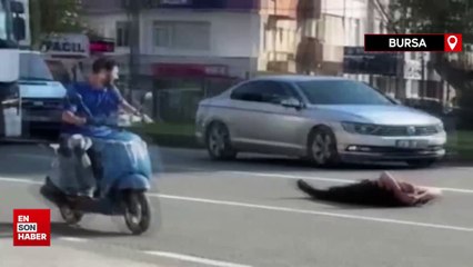 Bursa'da trafiğe aldırmayan adam yolun ortasına uzandı
