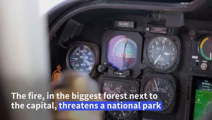 Greek firefighting aircraft drop water on Mount Parnitha wildfire