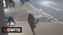 Moment two masked burglars raid London tech shop - by using power tools to cut through shutters