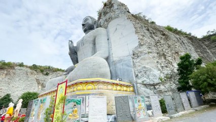 Giant Buddha Carved in Stone Wat Khao Tham Thiam at U Thong Province in Suphan Buri Thailand