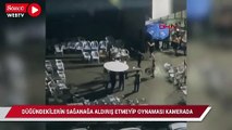 Düğündekilerin sağanağa aldırış etmeyip oynaması kamerada