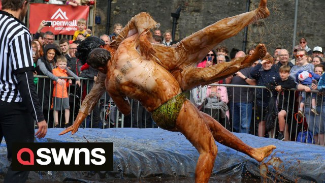 Hundreds of revellers are watching ‘world gravy wrestling championships'