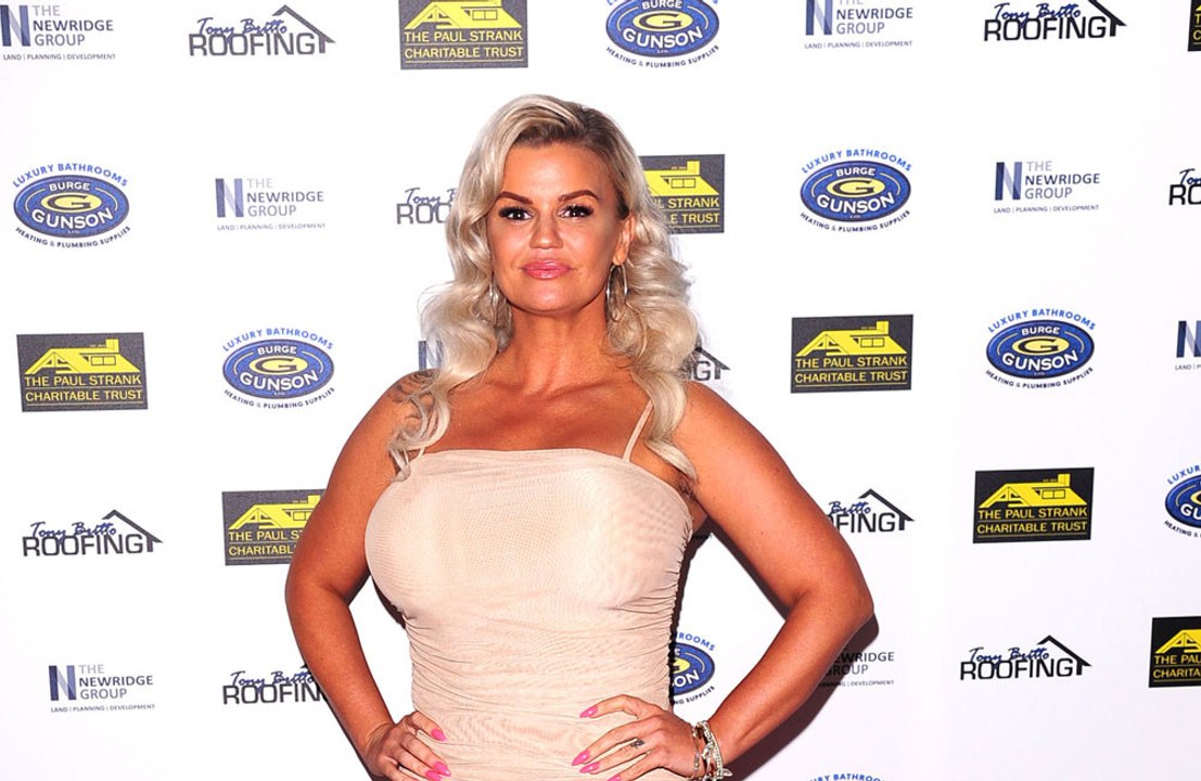 Kerry Katona has branded her ex-husband Brian McFadden a "s*** dad