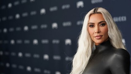 Kim Kardashian's Athleisure Look Included a Sheer Tank Top, Parachute Pants, and Her New Favorite Accessory