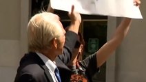 Former Trump advisor Peter Navarro attempts to snatch ‘Trump lost’ sign from protester