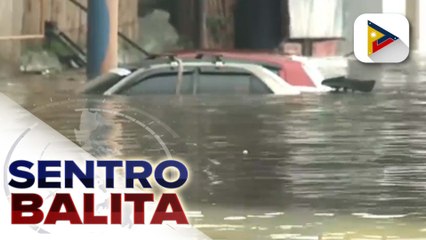 Isang kotse, muntik nang anurin sa Marikina River matapos tumaas ang lebel nito