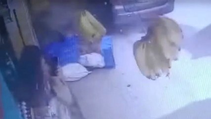 Shopper hit by car carries on phone call after escaping unharmed