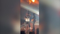 Moment 50 Cent appears to throw malfunctioning mic off stage during LA concert