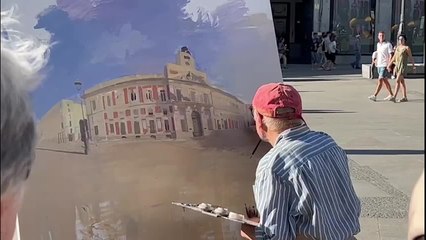 Antonio López pintando en la Puerta del Sol
