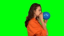 Woman Inflating a Blue Balloon Green Screen video HD footage