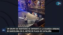 Un grupo de manteros se enfrenta a la Guardia Urbana de Barcelona en el metro de plaza de Cataluña
