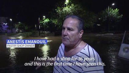 Torrential rains kill one in Greece after wildfires