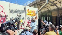 Angry depositors spray paint slogans outside Lebanon's Central Bank