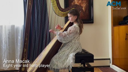 Eight-year-old Anna Macak playing the harp - The Courier - September 8, 2023