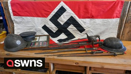 Police called after auctioneer hoists Nazi swastika flag in shop window to promote WW2 auction