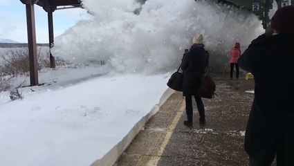 Train Creates Wave Of Snow Over People