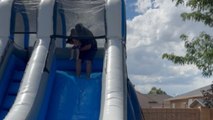 Fun uncle's epic waterslide adventure backfires when he fails to stick the landing!