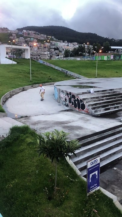 Skateboarder ollies set of stairs and lands on his ankle