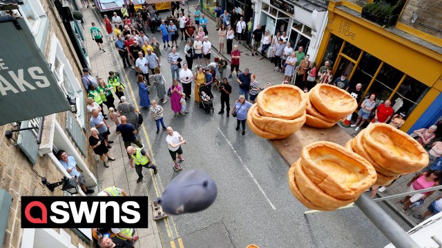 Annual World Black Pudding Throwing Championships sees competitors knock Yorkshire puddings off a 20ft plinth
