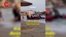 Kuşadası’nda Kadınlar Plajı'na botla 30 kişilik kaçak sığınmacı geldi ve sokaklara dağıldılar. (Ajans Kuşadası)