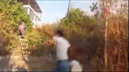 Köylerini saran yangını söndürmek için kadın erkek, yediden yetmişe seferber oldu