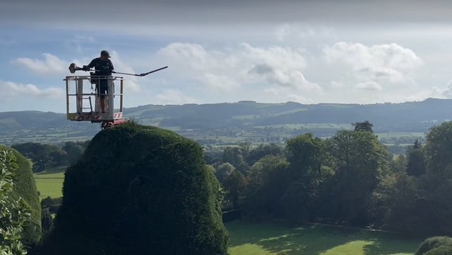 Worker prunes 55ft 18th-century hedges using cherry picker in ‘world’s toughest gardening job’