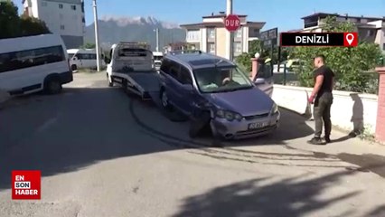 Denizli'de otomobille çarpışan okul servisi apartman bahçesine uçtu