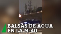 Grandes balsas de agua e inundaciones en la M-40 por las fuertes lluvias en Madrid