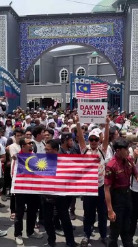 Hundreds of demonstrators gather at Kampung Baru mosque on Malaysia Day