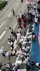 Demonstrators gather at Kampung Baru mosque on Malaysia Day