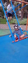 Mom Deftly Catches Son Falling From Swing