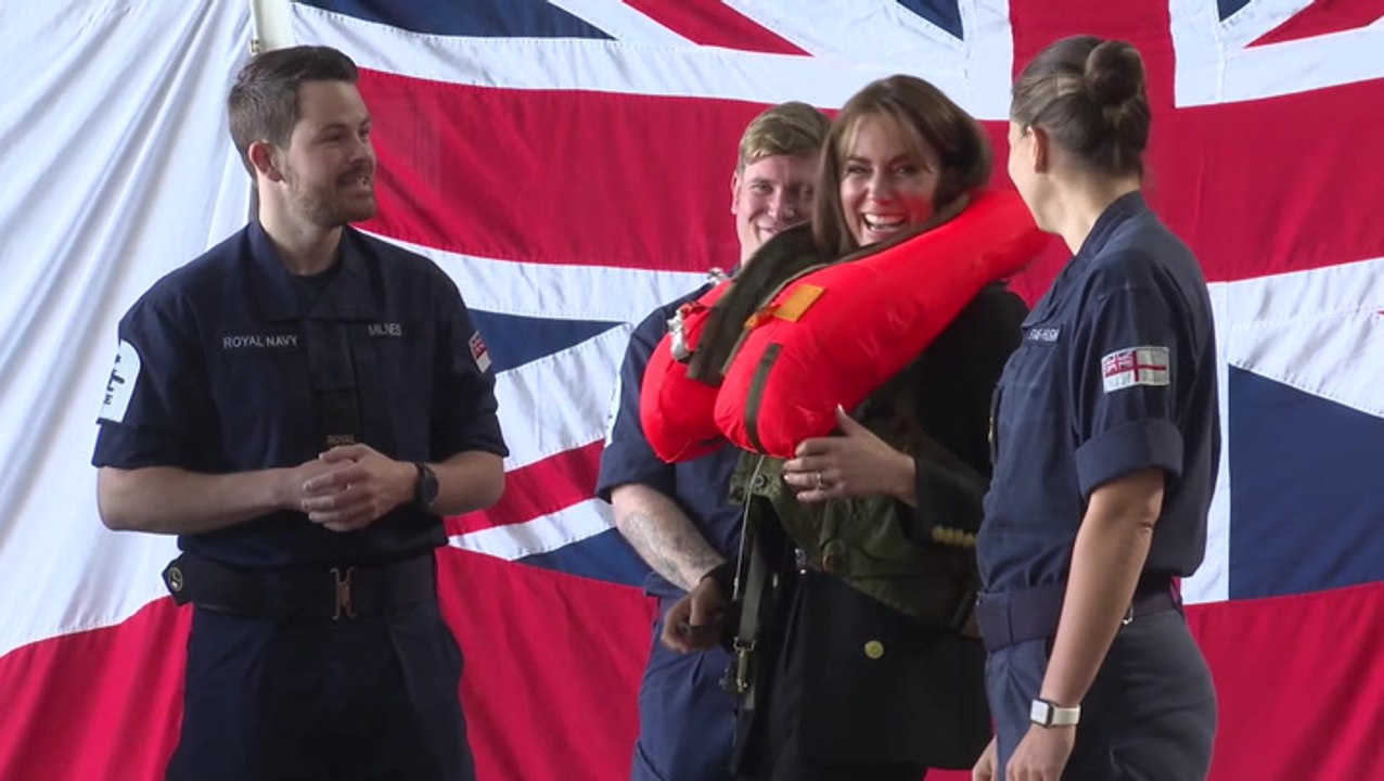 Princess of Wales giggles as she tries on inflatable life jacket
