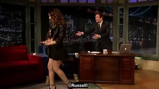 Russell Brand is told off by a US talk show host after suggestively bouncing an uncomfortable Katharine McPhee on his lap in resurfaced video