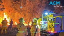 Residents are on high alert as firefighters battle a blaze on a hill near Townsville, in Queensland.