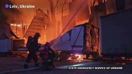 Firefighters tackle blaze after drone strike on Lviv