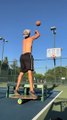 Guy Throws Multiple Basketball Trickshots While Balancing Himself on Rola-Bola