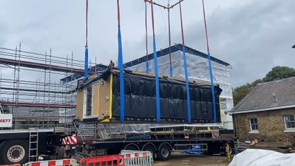 Watch as 12 tonne home craned into place
