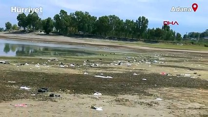 Suyu çekilen Seyhan Baraj Gölü kıyısında piknikçi kirliliği
