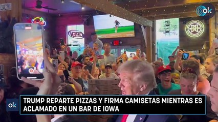 Trump reparte pizzas y firma camisetas mientras es aclamado en un bar de Iowa