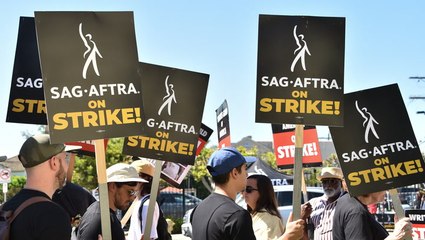 'Acting president' Martin Sheen reunites with West Wing costars to deliver rousing speech from picket line