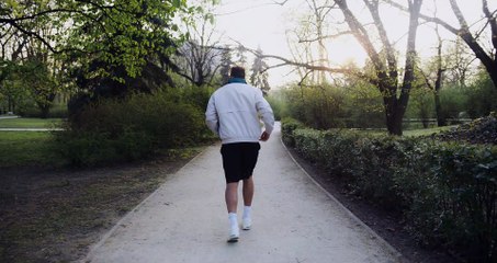 man walking on road video free for commercial use