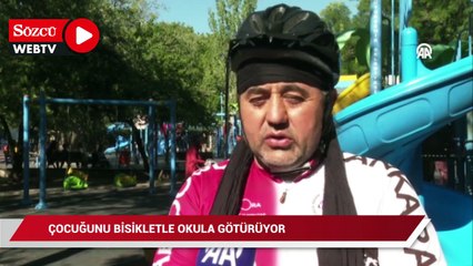 Velilere bisiklet sevgisini aşılamak için çocuğunu bisikletle okula götürüyor